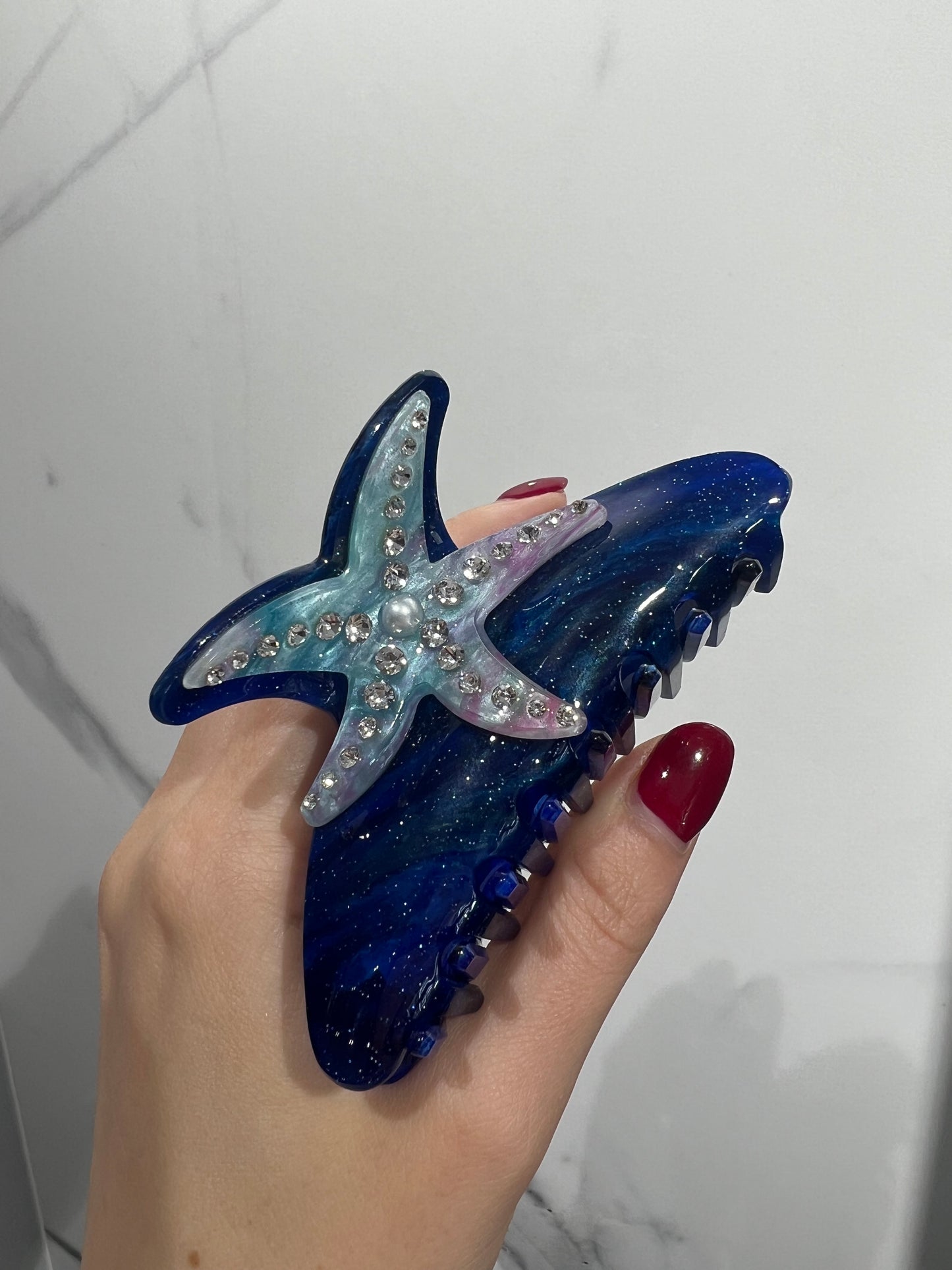Fermaglio per capelli a forma di stella con diamanti blu scuro